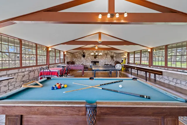 The game room with pool table, ping pong and shuffleboard